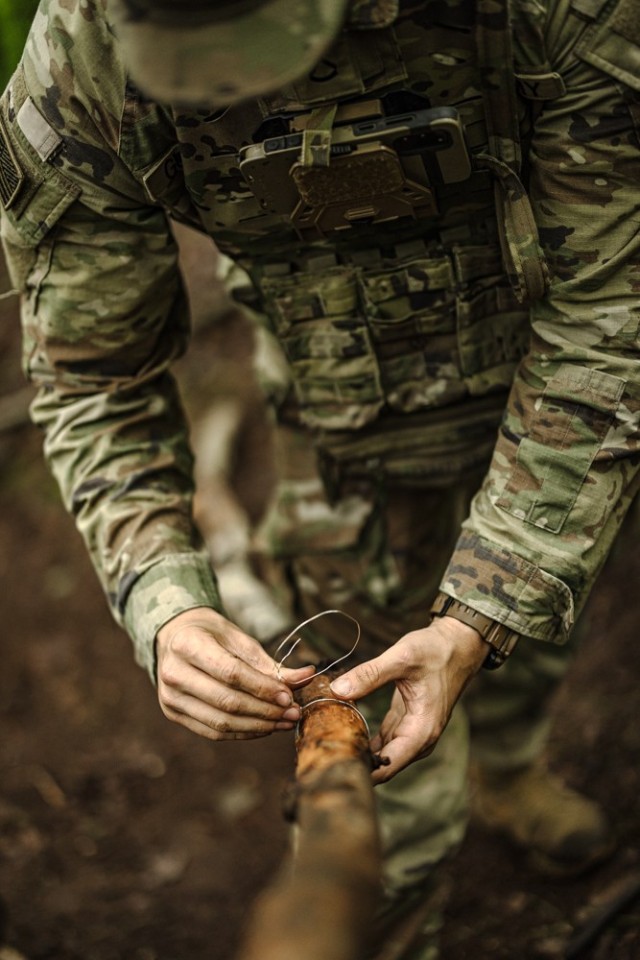 Cadets learn how to start a fire while receiving survival instruction from task force soldiers from the 101st Airborne Division June 10 during Cadet Summer Training. Photo by Jorge Garcia/ USMA-PAO.