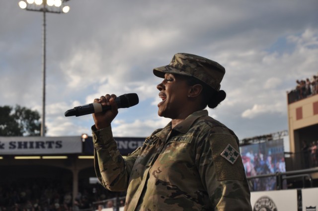 COLORADO SPRINGS, Colo. — Staff Sgt. Talia Smith, 4th Infantry Division Band, performs the national anthem at the National Finals Rodeo Open at the Pikes Peak or Bust Rodeo 4th Infantry Division and Fort Carson Night, July 9, 2025, at the...