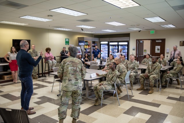 Chef Robert Irvine, while visiting the Office of Chief of the Army Reserve at Fort Belvoir, participates in a brief question and answer session with Soldiers and civilians assigned to the office. Most of the topics covered healthy eating options...