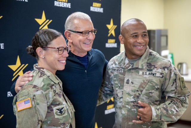 Chef Robert Irvine (center) concludes his discussion at the Office of Chief of the Army Reserve by taking photos with Soldiers and Department of the Army civilians in attendance. His visit to OCAR was the first stop on his July 10 tour of Fort...