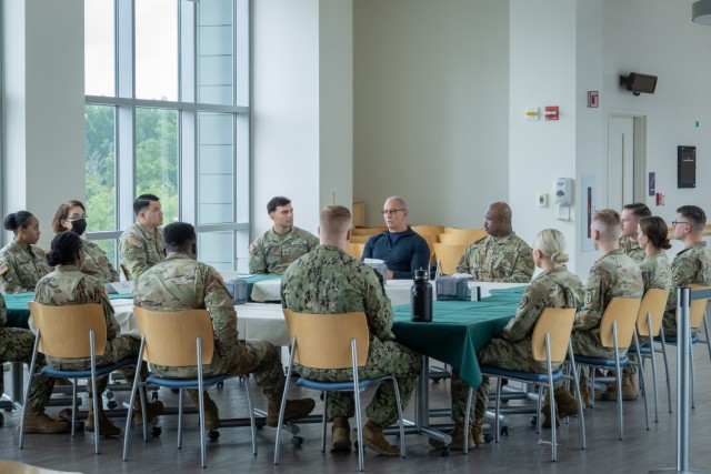 Chef Robert Irvine met with hospital director, Col. Gina Adam and Command Sgt. Maj. Tanya Boudreaux and several Soldiers, Sailors and Airmen assigned to Alexander T. Augusta Military Medical during a tour of Fort Belvoir Thursday, July 10. The...