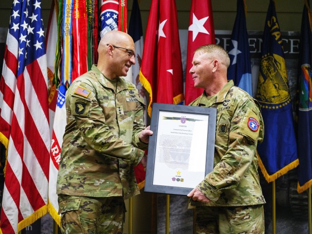 Lt. Gen. Johnny Davis, USAREC CG, welcomes Chief Warrant Officer 5 Chad Bowen, incoming USAREC CCWO. Army photo by: Robert Hold, USAREC G-7