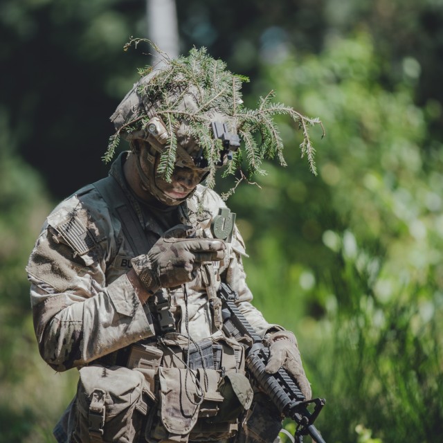 U.S. Army Sgt. Theodore Buckley, an air and missile defense crewmember assigned to 5th Battalion, 4th Air Defense Artillery, 10th Army Air and Missile Defense Command, checks his azimuth on the compass during the U.S. Army Europe and Africa Best...