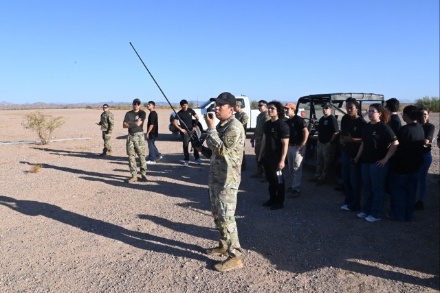 Recent Army recruits from the Yuma, Arizona area watch a static line parachute jump conducted by members of U.S. Army Yuma Proving Ground&#39;s elite Airborne Test Force on July 10, 2025.