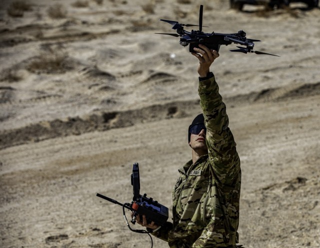 U.S. Army Spc. Mahdi Amirouche, assigned to 82nd Airborne Division, prepares to launch an individual launched drone during Project Convergence - Capstone 5 (PC-C5) at Fort Irwin, Calif. The small, short-range drone can be used for reconnaissance,...