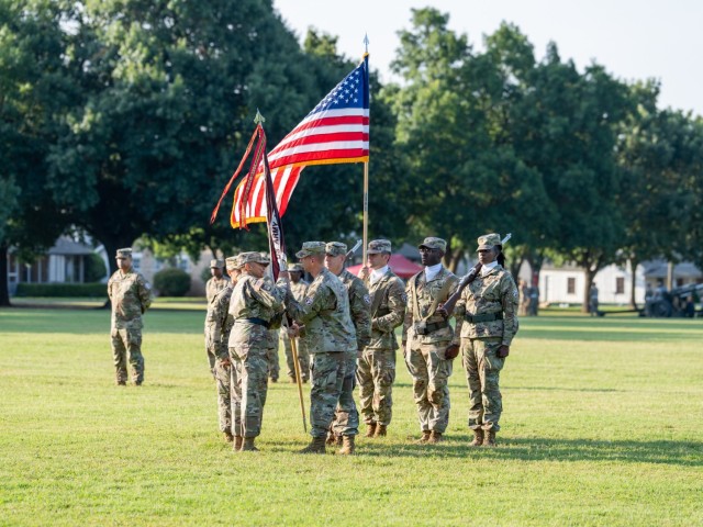 Col. Jason Ferguson passes the MEDDAC Colors to Brig. Gen. YR Summons during the Reynolds Army Health Clinic change of command ceremony