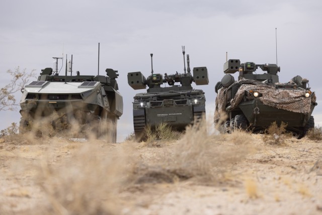 The Mission Command on The Move (MCOTM), left, M-SHORAD Human Integration Machine (HMI), center, and SGT STOUT, right, coordinate the next moves during Project Convergence-Capstone 5 (PC-C5) on Fort Irwin, Calif., early March 2025. PC-C5 is the...