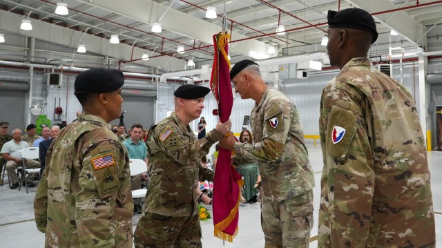 Brig. Gen. Daniel Duncan, commander of Joint Munitions Command, passes Crane Army Ammunition Activity organizational colors to Col. Aaron Cornett during a July 17 Change of Command ceremony on Naval Support Activity, Crane. Passing the colors...