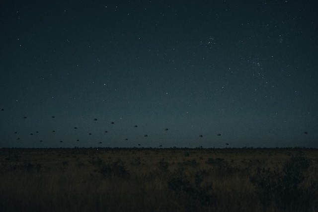 Paratroopers from the United States Army, French Armed Forces and German Army conduct an airborne insertion at night into the Charters Towers region, during Exercise Talisman Sabre.