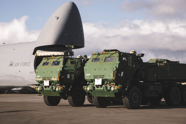 High Mobility Artillery Rocket System (HIMARS) launchers assigned to the 25th Infantry Division are staged on the flight line after being unloaded from an Air Force C-5 Galaxy at Joint Base Pearl Harbor-Hickam, on July 14, 2025. This...