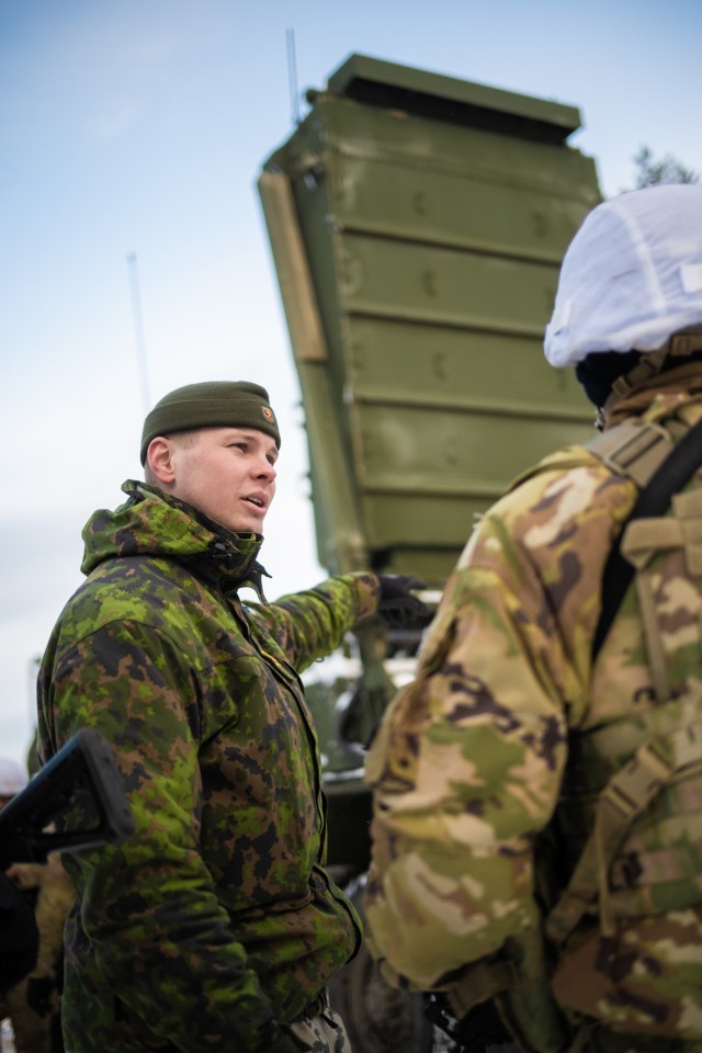 Finnish Army Staff Sgt. Mikko Partanen, radar platoon leader, Karelia Brigade, asks for details on the ANT/PQ-53 radar system during exercise Dynamic Front 25 at Ravajarvi Training Area, Rovaniemi, Finland, Nov. 19, 2024. Dynamic Front takes place...
