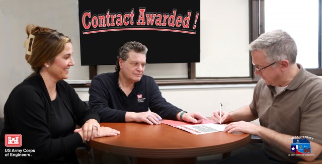 Illustrative photo of Tulsa District, U.S. Army Corps of Engineers, contracting officers presenting a contract for signing.