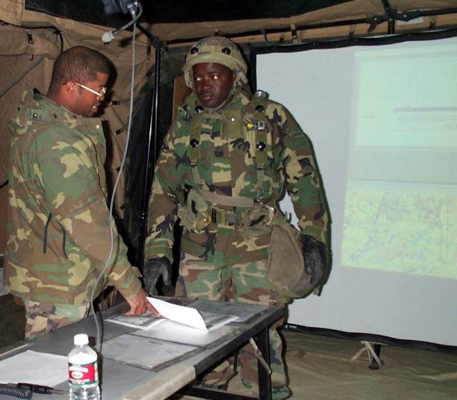 The battalion intelligence NCO briefs a soldier during the Division Capstone Exercise at Fort Irwin, Calif., on April 5, 2001. The Army recently upgraded old guidance on the removal and disposal of legacy Organizational Clothing and Individual...