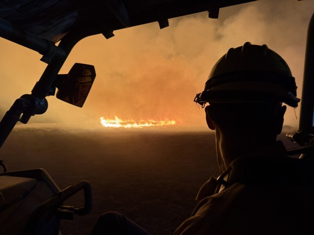 Fort Hunter Liggett heavy equipment operator monitoring the Madre Fire