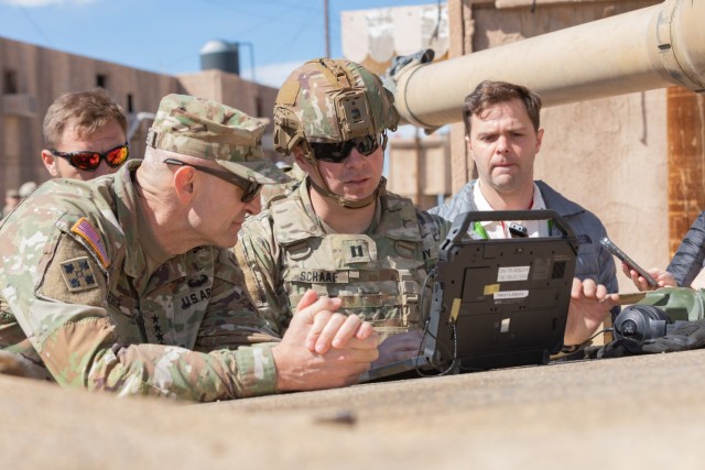 Gen. Randy George, Chief of Staff of the Army, discusses next generation command and control (C2) system capabilities with a 1st Infantry Division Soldier during a human machine Integration demonstration at Project Convergence - Capstone 4, Fort...