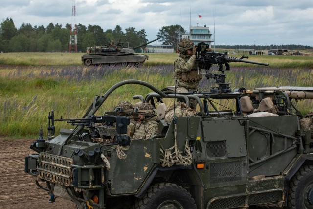 British army soldiers assigned to the Quebec Company, 1st Royal Yorkshire Regiment, operate a Mobility Weapon-Mounted Installation Kit “Jackal,” while a U.S. Army M1A2 System Enhanced Package V3 Abrams Main Battle Tanks assigned to Alpha...