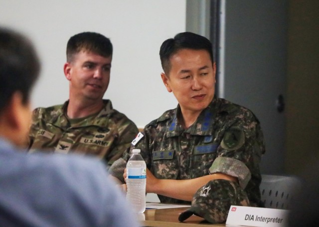 FED and MND-DIA leadership speak at a joint symposium.