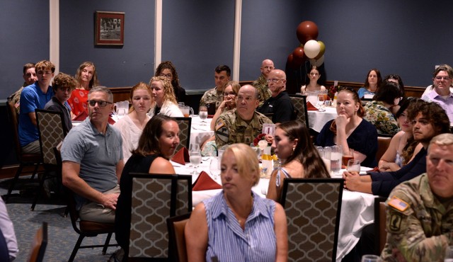 Scholarship recipients and their family members listen as Fort Leavenworth Frontier Heritage Communities Marketing Coordinator Hannah Adams welcomes them to a luncheon in their honor July 23, 2025, at the Frontier Conference Center at Fort...