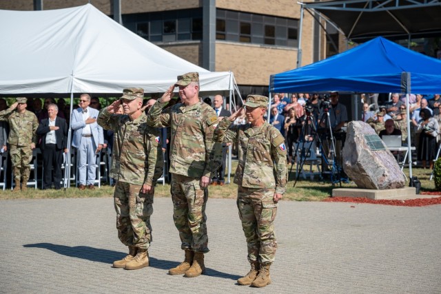 Maj. Gen. Michael B. Lalor, Lt. Gen. Christopher O. Mohan and Brig. Gen. Beth A. Behn salute during the July 22, 2025, change of command ceremony at the Detroit Arsenal.