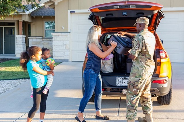 A family unloads their vehicle during a permanent change of station move in Fort McCoy, Wis., July 25, 2022. The Permanent Change of Station Joint Task Force, established in May at the direction of Defense Secretary Pete Hegseth, collaborates with...
