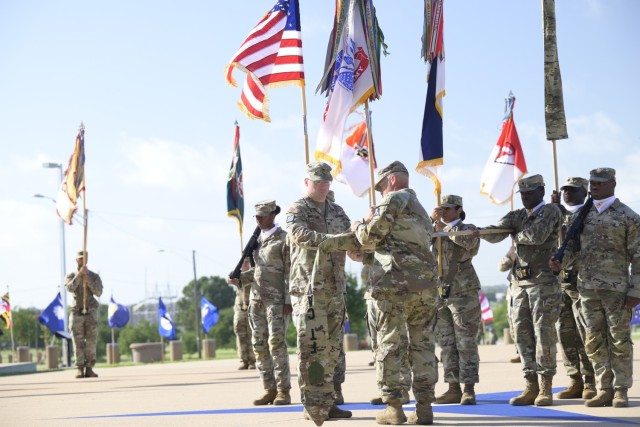 From left, Col. Mark McClellan, U.S. Army Garrison-Fort Hood commander, and Command Sgt. Maj. Loyd Rhoades, U.S. Army Garrison-Fort Hood command sergeant major, case the colors for Fort Cavazos during the Fort Hood redesignation ceremony July 28,...