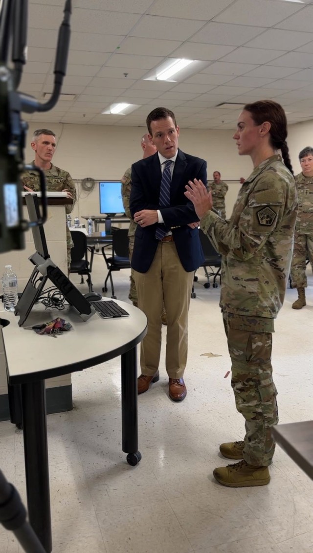 U.S. Army Chief Warrant Officer two Stacey Larson briefs Mr. Brandon Pugh, Principal Cyber Advisor to the Secretary of the Army, on July 21, 2025, at Fort Gordon, GA, on Spectrum Guard, a portable radio frequency (RF) detection and monitoring...