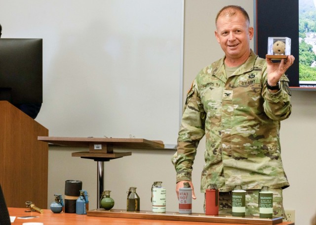 PICATINNY ARSENAL, N.J. - Col. Vinson Morris, Project Manager Close Combat Systems (PM CCS), holds an incendiary grenade that was produced on the site of Picatinny Arsenal, approximately 250 years ago, in support of Gen. George Washington and the...