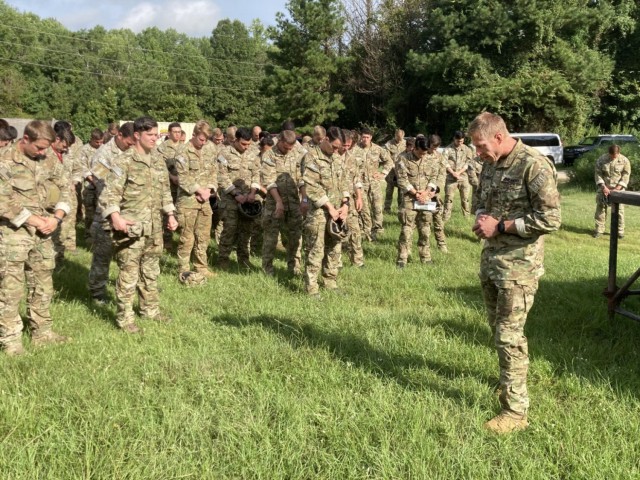 Army Chap. (Capt.) Bryce A. Wiltermood prays with 75th Ranger Regiment soldiers in advance of a parachute jump at Fort Benning, Ga., in September 2023.