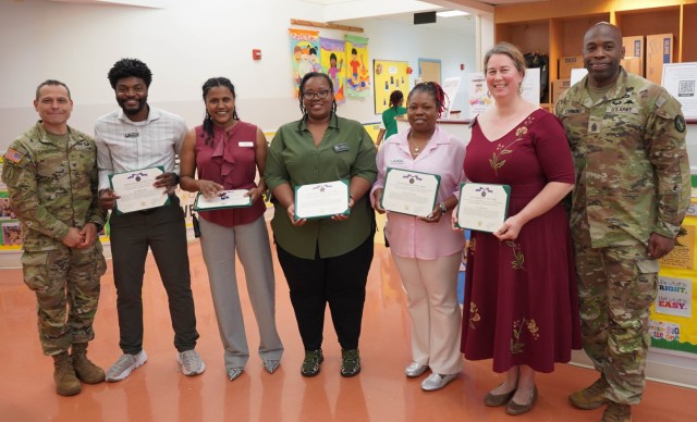 Joint Base Myer-Henderson Hall Commander, Col. Keith Sandoval and Command Sergeant Major Kenyon Simmons recognize Cody Child Development Center employees for exceptional performance.