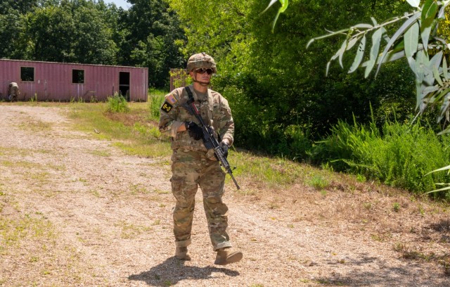Sgt. 1st Class Gil Rodriguez, a drill sergeant with Company C, 2nd Battalion 10th Infantry Regiment, 3rd Chemical Brigade, walks across Training Area 247M July 22, during the second day of the four-day Maneuver Support Center of Excellence Drill...