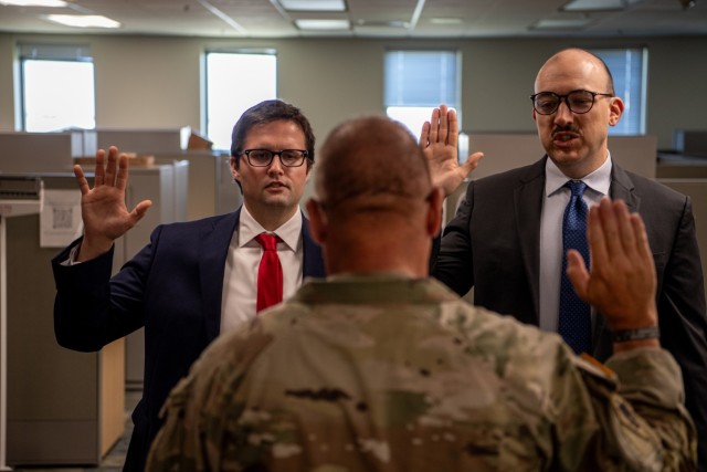 (left to right) Capt. George Bouziden and Capt. Derek Teague takes the Oath of Commissioned Officers during their direct commissioning ceremony at the Armed Forces Reserve Center in Norman, Oklahoma, July 30, 2025. The two officers received their...