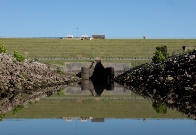 Water is pumped from the stilling basin during a dewatering below Sardis Dam in Sardis, Okla., July 29, 2025. The Tulsa District, U.S. Army Corps of Engineers set up a small dam to pump water from the stilling basin before inspecting the condiuit...