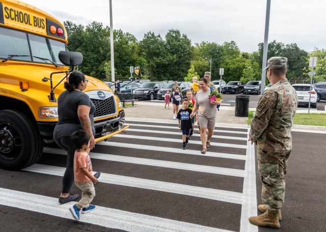 The Van Voorhis Elementary School faculty and school mascot welcomes students to the 2025-26 school year at Fort Knox, Kentucky, Aug. 4, 2025. Fort Knox senior enlisted leader Command Sgt. Maj. Alex Licea also joined in welcoming students and...