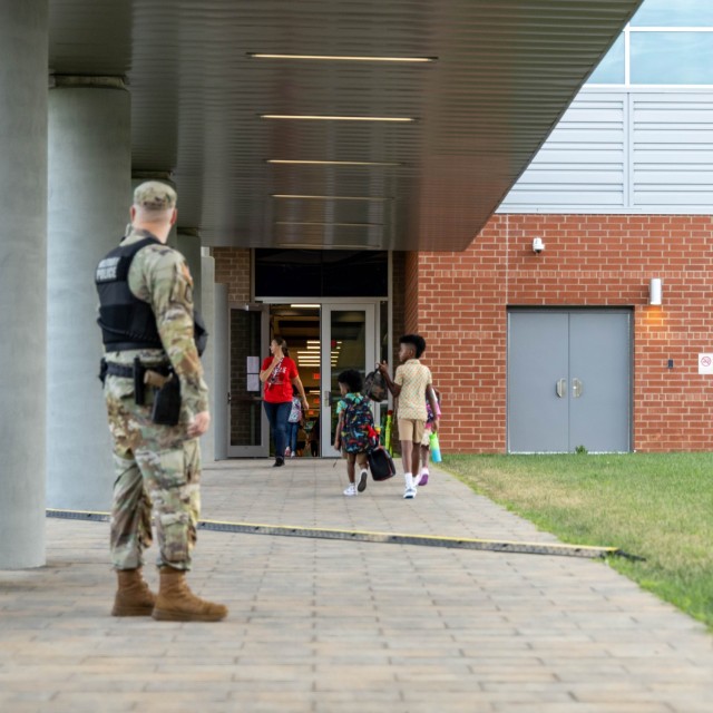 The Van Voorhis Elementary School faculty and school mascot welcomes students to the 2025-26 school year at Fort Knox, Kentucky, Aug. 4, 2025. Fort Knox senior enlisted leader Command Sgt. Maj. Alex Licea also joined in welcoming students and...