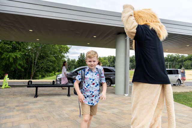The Van Voorhis Elementary School faculty and school mascot welcomes students to the 2025-26 school year at Fort Knox, Kentucky, Aug. 4, 2025. Fort Knox senior enlisted leader Command Sgt. Maj. Alex Licea also joined in welcoming students and...