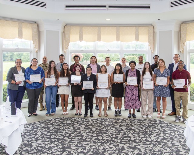 David H. Dentino, Deputy Assistant Secretary of the Army for Installations, Housing and Partnerships, right, poses with Fort Belvoir scholarship recipients during an awards ceremony at the Mount Vernon County Club,  July 18. Mr. Dentino urged  the...
