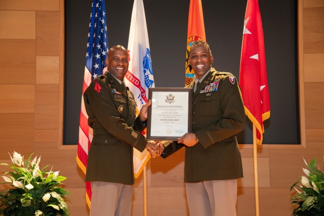 (From left) Lt. Gen. Jeth B. Ray, deputy chief of staff, Army G-6 presents the Department of the Army Certificate of Retirement to Col. Reginald M. Harris, the U.S. Army Communications-Electronics Command director of Plans and Operations G3/5....