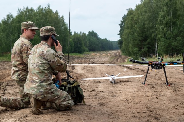 Two U.S. Army Soldiers establish radio communication during a series of counter-UAS training events.