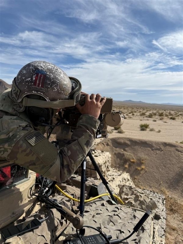 A 1st Brigade Combat Team, 1st Armored Division Soldier experiments with an unmanned aerial system during Project Convergence Capstone 5 at Fort Irwin, California. Army researchers are aiming to deliver aided target recognition to UAS, speeding up...