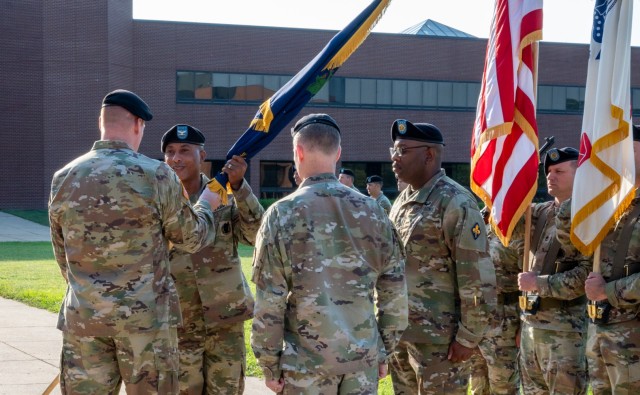 Col. Fredrick Parker (center), officially becomes the U.S. Army Chemical, Biological, Radiological and Nuclear commandant by accepting the regiment’s flag from Maj. Gen. Christopher Beck, Maneuver Support Center of Excellence and Fort Leonard...