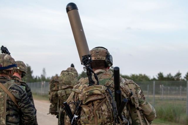 Spc. Robert Bowley, an electromagnetic warfare specialist with the 37th Infantry Brigade Combat Team, moves toward the Combined Arms Collective Training Facility to begin his mission monitoring the electromagnetic spectrum with the Beast+ system...