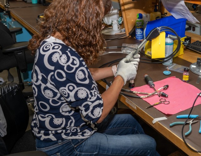 Marylin Barnett, electronics mechanic at Tobyhanna Army Depot (TYAD), performs cable “potting” by encasing the cables in a protective substance to ensure optimal performance in harsh environments.  Power cables are a critical component to the...