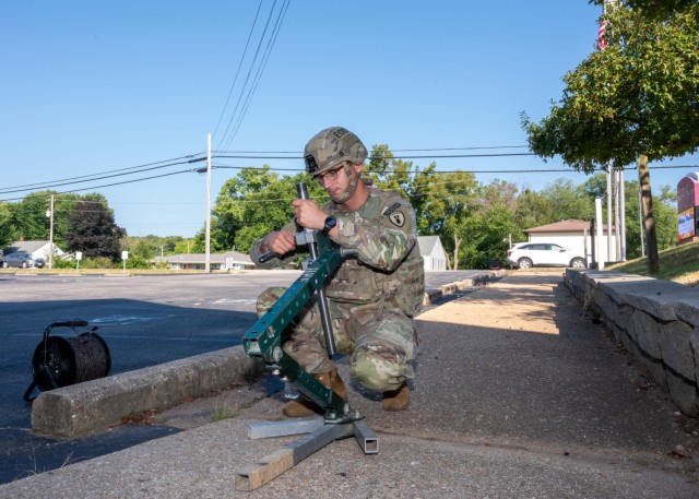 Sgt. Craig Qualley, with the 763rd Ordnance Company (EOD), prepares a percussion actuated neutralizer for use in a render safe procedure of an improvised explosive device Aug. 5 during a homeland response exercise with local enforcement in...