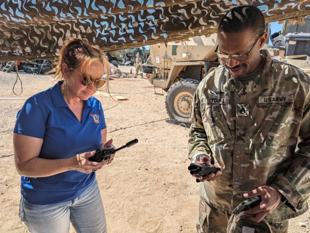 Sherry Smith, CSLA CIR for CONUS West Coast Region, assisting with troubleshooting a KMI Operating Account Manager during a National Training Center rotation.