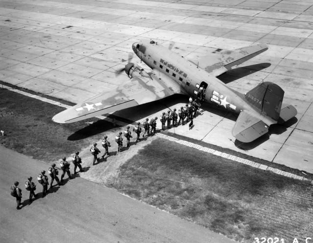 Paratroopers board a Douglas C-47 aircraft to perform a practice jump at Fort Benning, Ga., August 1946.