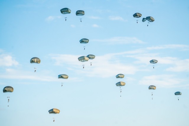 Paratroopers assigned to the 82nd Airborne Division conduct a parachute jump on Sicily Drop Zone, Fort Liberty, NC, August 21, 2024. The 82nd Airborne Division rapidly deploys within 18 hours of notification, strategically deploys, conducts...