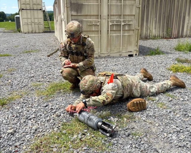 Army National Guard Soldiers assigned to the 430th EOD Company, part of the North Carolina Army National Guard, and the 387th EOD Company, Massachusetts Army National Guard, conduct measurements to aid in the identification of an unexploded...