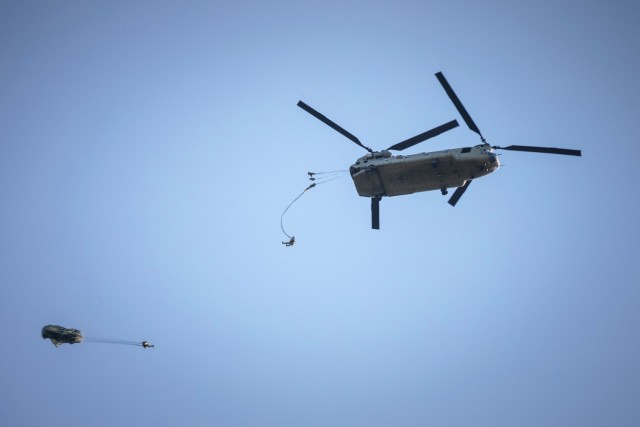 U.S. Army and International Paratroopers conduct a static line Airborne jump using their MC-6 parachutes out of a Ch-47 Chinook Helicopter during Leapfest at Glen Rock Drop Zone, Exeter, Rhode Island, August 2, 2025. All competing Paratroopers use...