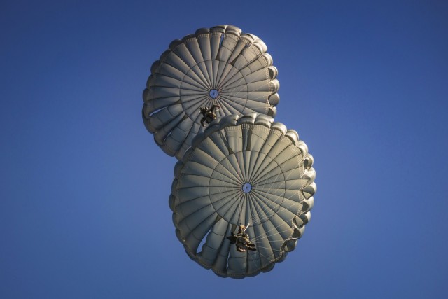 U.S. Army and International Paratroopers conduct a static line Airborne jump using their MC-6 parachutes out of a Ch-47 Chinook Helicopter during Leapfest at Glen Rock Drop Zone, Exeter, Rhode Island, August 2, 2025. All competing Paratroopers use...