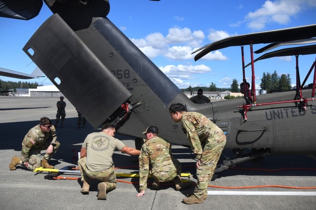 U.S. Army National Guard Soldiers from 1st Battalion 168th General Support Aviation Regiment assist in UH-60 Black Hawk helicopter load up in support of Enduring Partners at Joint Base Lewis-McChord, Wash., August 13, 2025. Enduring Partners 2025...